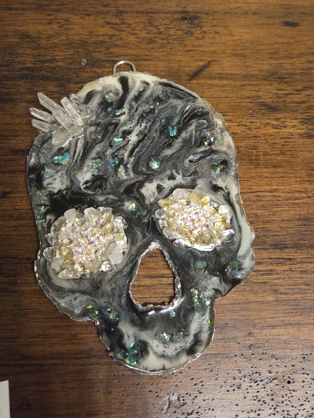 Handcrafted Black and White Resin Skull Wall Accent with Iridescent Crystal Eyes